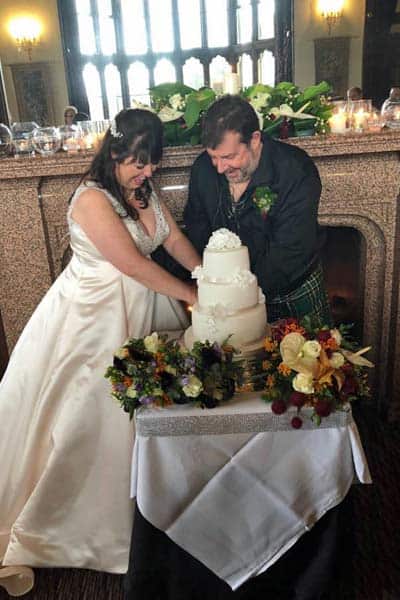 Julie and Rodger with their wedding cake at Mar Hall