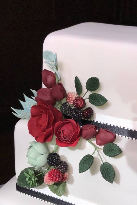 close-up Rustic Sugar Berries on square Wedding cake