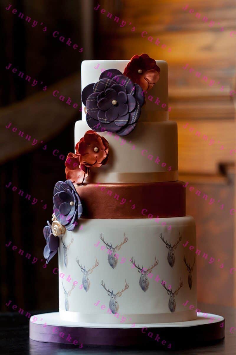 Designer Scottish Wedding cake, with Stags and Tartan flowers